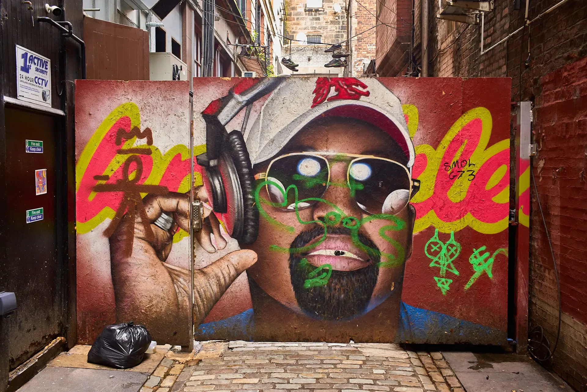 An opaque and painted portal in the centre of Glasgow, in a dark and dirty alley...