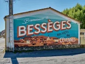Welcome sign at the city entrance of Bessèges (Gard) flamboyant and colorful with a neat lettering (collective Capital Letters)