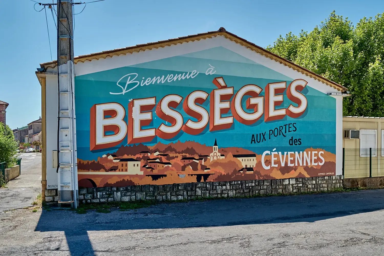Welcome sign at the city entrance of Bessèges (Gard) flamboyant and colorful with a neat lettering (collective Capital Letters)