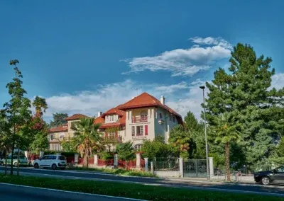 traditional Basque villa , roof of red tiles and in red colors also balustrades