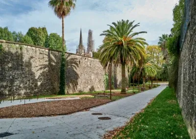 in the distance, beyond the old ramparts of the city, the cathedral in the tan of being renovated